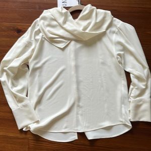 A beautiful cream colored blouse by Zara women’s size medium